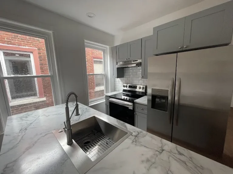 Kitchen with stainless appliances in Baltimore Ave 203(k) renovation
